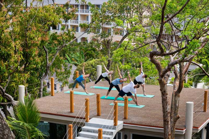 group of single travellers taking a yoga class on a BodyHoliday