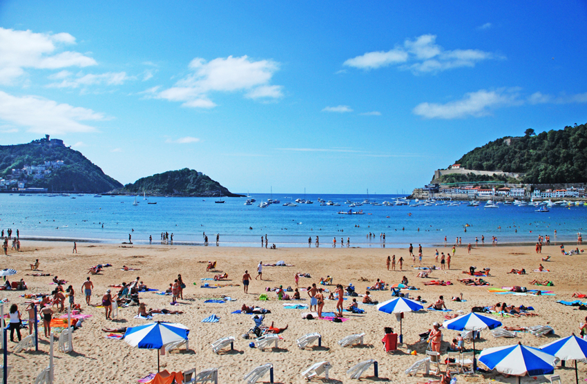 Tourists on a busy beach in Spain