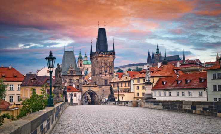 Take a walk over majestic Charles Bridge during sunset