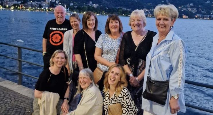 Group of people by Lake Como